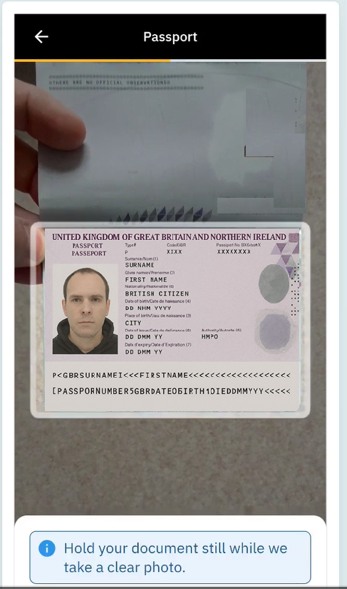 Example of a good passport photo for ID verification: all four corners visible in the frame, no glare or reflection, taken in good natural light and in sharp focus